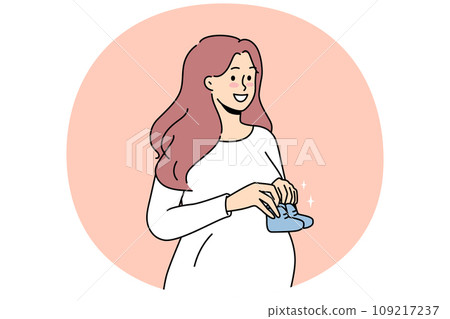 Smiling pregnant woman with baby shoes Smiling pregnant woman with baby shoes 109217237