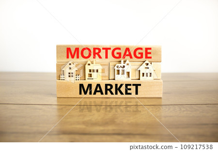 Mortgage market symbol. Concept words Mortgage market on beautiful wooden blocks. Beautiful wooden table white background. House model. Business mortgage market concept. Copy space. Mortgage market symbol. Concept words Mortgage market on beautiful wooden blocks. Beautiful wooden table white background. House model. Business mortgage market concept. Copy space. 109217538
