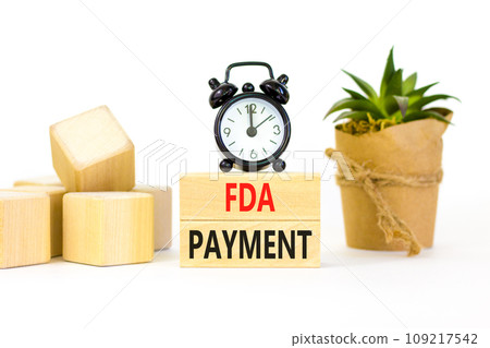 FDA Food and Drug Administration payment symbol. Concept words FDA payment on beautiful wooden blocks. Beautiful white table background. Black alarm clock. Business FDA payment concept. Copy space. FDA Food and Drug Administration payment symbol. Concept words FDA payment on beautiful wooden blocks. Beautiful white table background. Black alarm clock. Business FDA payment concept. Copy space. 109217542