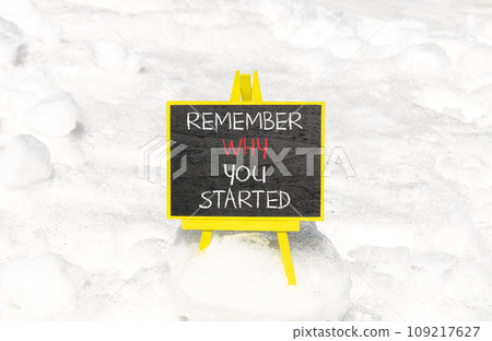 Remember why you started symbol. Concept word Remember why you started on beautiful black chalk blackboard. Beautiful white snow background. Business remember why you started concept. Copy space. 109217627