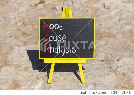 RCA root cause analysis symbol. Concept words RCA root cause analysis on beautiful black chalk blackboard. Beautiful stone beach background. Business and RCA root cause analysis concept. Copy space. 109217628