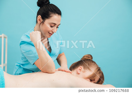 health osteopathy massage therapist gives massage to the client in the office health osteopathy massage therapist gives massage to the client in the office 109217688
