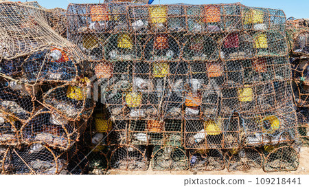 Prawn and shrimp traps at the fishing port of Essaouira, Morocco. Fishermen strategically place the prawn traps on the ocean floor, often baiting them to attract the prawns. 109218441