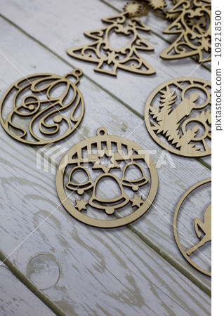 Wooden toy with bells to decorate the Christmas tree for the New Year holiday Wooden toy with bells to decorate the Christmas tree for the New Year holiday 109218500