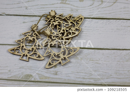 Set of wooden small Christmas trees tied together for decoration for the New Year Set of wooden small Christmas trees tied together for decoration for the New Year 109218505