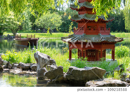 Japanese garden with pagoda and pond in summer. 109218588
