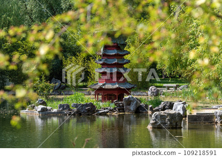 Japanese garden with pagoda and pond in summer. 109218591