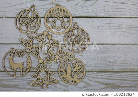 Set of wooden flat toys for the Christmas tree. Simple decorations for the New Year on a white background Set of wooden flat toys for the Christmas tree. Simple decorations for the New Year on a white background 109218624