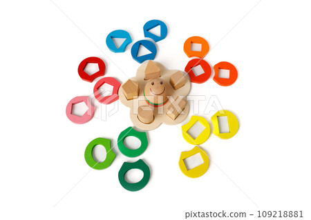 Wooden puzzle toy that develops logic and fine motor skills with colorful blocks of different shapes isolated on white background Wooden puzzle toy that develops logic and fine motor skills with colorful blocks of different shapes isolated on white background 109218881