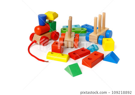 A set of Montessori children's educational toys made from different blocks and puzzles isolated on white background A set of Montessori children's educational toys made from different blocks and puzzles isolated on white background 109218892
