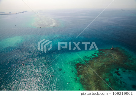 Persian Gulf aerial view, Saudi Arabia. Red beacon tower stands in shallow waters 109219061