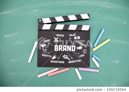 BRAND. Movie clapper and colored pieces of chalk BRAND. Movie clapper and colored pieces of chalk 109219564