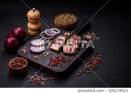 Delicious fresh bacon stripes with spices and salt Delicious fresh bacon stripes with spices and salt 109219923