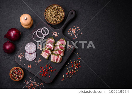 Delicious fresh bacon stripes with spices and salt Delicious fresh bacon stripes with spices and salt 109219924