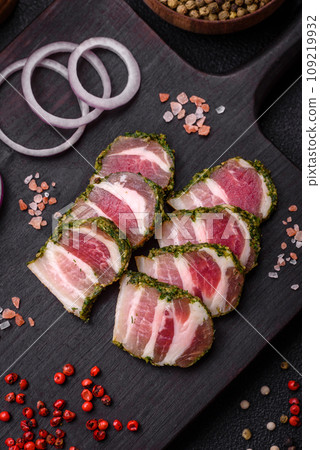 Delicious fresh bacon stripes with spices and salt Delicious fresh bacon stripes with spices and salt 109219932