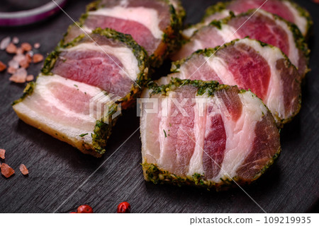 Delicious fresh bacon stripes with spices and salt Delicious fresh bacon stripes with spices and salt 109219935