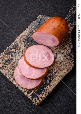 Delicious smoked sausage with salt and spices cut into slices 109219967