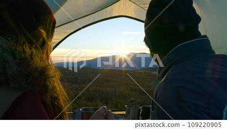 Close up of multiethnic couple of tourists drinking tea 109220905