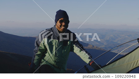 Multiethnic backpacker friends rest during a hike 109220948