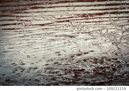 Background with splashes and drops of water in the lake, river or sea. Background with splashes and drops of water in the lake, river or sea. 109221159