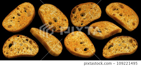 Spicy bruschetta crackers, bread croutons on black background Spicy bruschetta crackers, bread croutons on black background 109221495