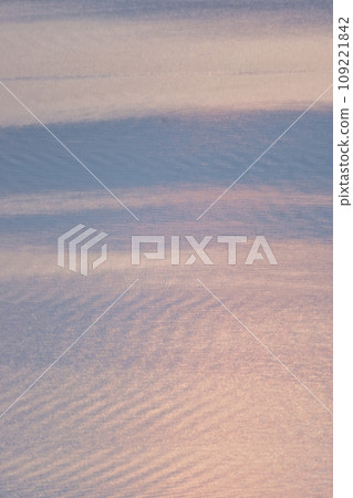 The surface of the lake dyed orange The surface of the lake dyed orange 109221842