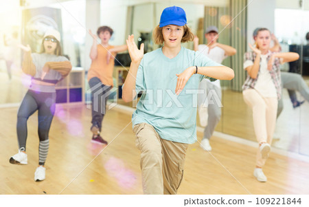 Youth boys and girls dancing hip-hop in ballroom Youth boys and girls dancing hip-hop in ballroom 109221844
