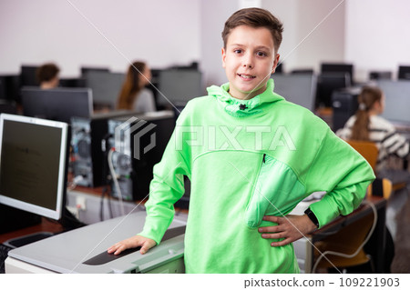 Portrait of a student with a notebook in computer class 109221903