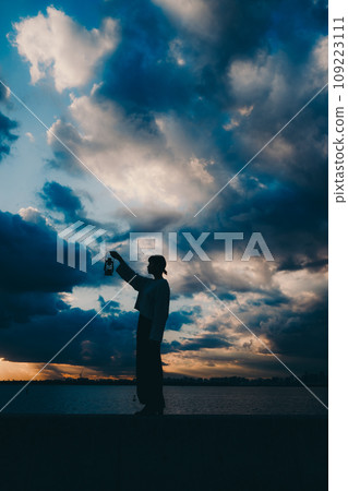 Young woman silhouette photo 109223111