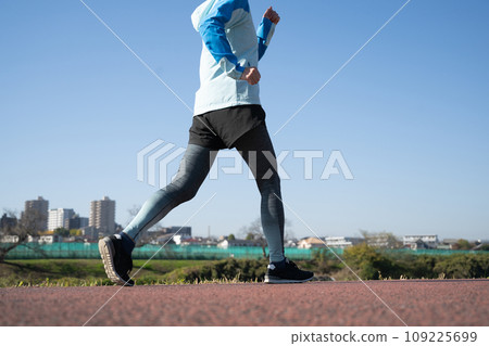 Women walking/jogging and blue sky 109225699