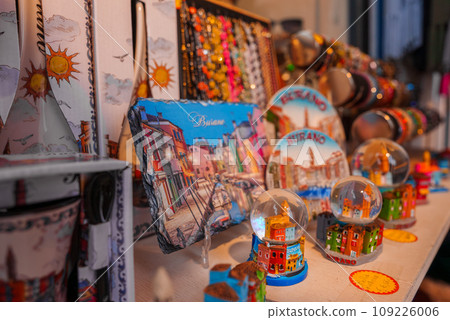 Explore a variety of Venetian souvenirs in this travel store display. From traditional trinkets to modern mementos, find the perfect keepsake to remember your trip to Venice. Explore a variety of Venetian souvenirs in this travel store display. From traditional trinkets to modern mementos, find the perfect keepsake to remember your trip to Venice. 109226006