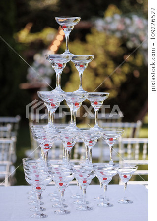Glasses of drink with cherry at a ceremony close-up Glasses of drink with cherry at a ceremony close-up 109226522
