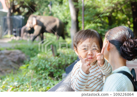 Baby happy to see elephant at zoo Baby happy to see elephant at zoo 109226864