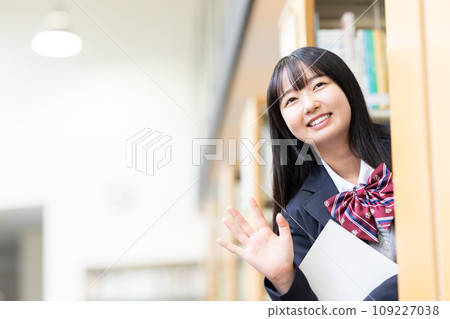High school girl choosing a book in the library Photography cooperation: Ariake College of Education and Arts High school girl choosing a book in the library Photography cooperation: Ariake College of Education and Arts 109227038