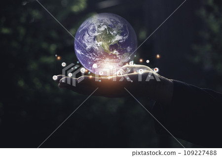 Hand holding circle network communication technology for global.Data in the global computer social.telecommunication,earth cryptocurrency.photo modern technology and communication concept. Hand holding circle network communication technology for global.Data in the global computer social.telecommunication,earth cryptocurrency.photo modern technology and communication concept. 109227488