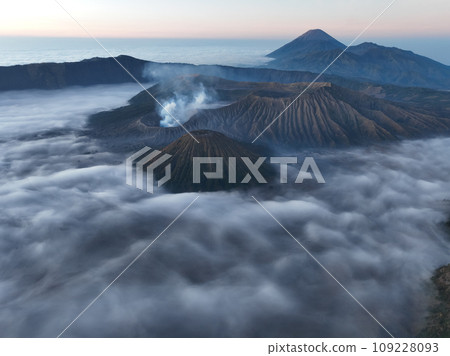 Aerial view Mountains at Bromo volcano during sunrise sky,Beautiful Mountains Penanjakan in Bromo Tengger Semeru National Park,East Java,Indonesia.Nature landscape background Aerial view Mountains at Bromo volcano during sunrise sky,Beautiful Mountains Penanjakan in Bromo Tengger Semeru National Park,East Java,Indonesia.Nature landscape background 109228093