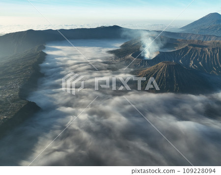 Aerial view Mountains at Bromo volcano during sunrise sky,Beautiful Mountains Penanjakan in Bromo Tengger Semeru National Park,East Java,Indonesia.Nature landscape background Aerial view Mountains at Bromo volcano during sunrise sky,Beautiful Mountains Penanjakan in Bromo Tengger Semeru National Park,East Java,Indonesia.Nature landscape background 109228094