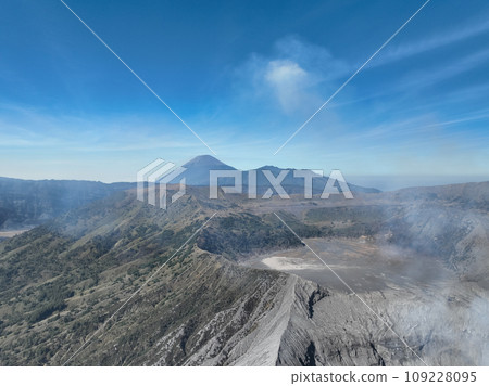 Aerial view Mountains at Bromo volcano during sunny sky,Beautiful Mountains Penanjakan in Bromo Tengger Semeru National Park,East Java,Indonesia.Nature landscape background Aerial view Mountains at Bromo volcano during sunny sky,Beautiful Mountains Penanjakan in Bromo Tengger Semeru National Park,East Java,Indonesia.Nature landscape background 109228095