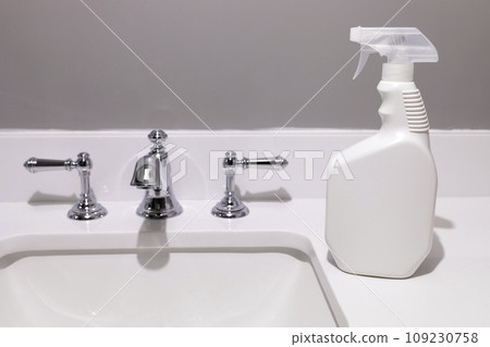 White Blank Plastic Spray Bottle On White Sink In Bathroom. Packaging Mockup. Unaltered, Spray Bottle, Hygiene. Lifestyle. Empty Place For Text Or Logo Horizontal Plane. Sanitary 109230758