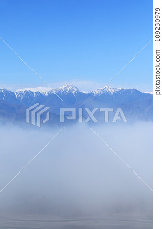 Northern Alps in early winter floating in a sea of clouds 109230979