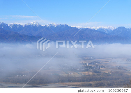 Northern Alps in early winter floating in a sea of clouds 109230987
