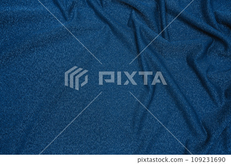 Background of draped dark blue fabric with silver lurex thread Background of draped dark blue fabric with silver lurex thread 109231690