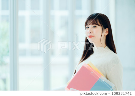 Female university student standing in the hallway Photography cooperation: Ariake College of Education and Arts Female university student standing in the hallway Photography cooperation: Ariake College of Education and Arts 109231741