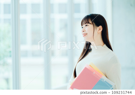 Female university student standing in the hallway Photography cooperation: Ariake College of Education and Arts Female university student standing in the hallway Photography cooperation: Ariake College of Education and Arts 109231744