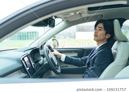 A man driving a car 109231757
