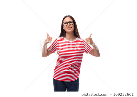 young charming brunette woman with glasses dressed in a striped t-shirt on a white background with 109232601