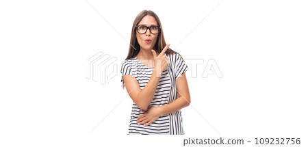 young pretty european brunette woman in a striped sweater gesturing actively on a white background 109232756