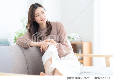 Young woman relaxing on the sofa in the living room 109235484