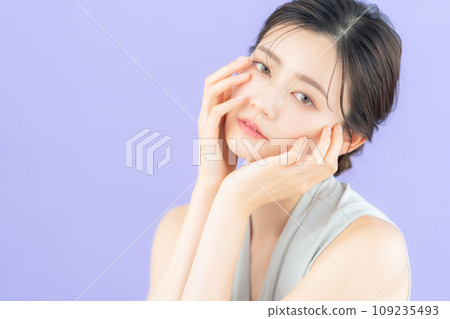 Young female fashion model posing with purple back Young female fashion model posing with purple back 109235493