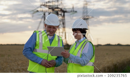 Maintenance with helmet laptop. Work brings satisfaction.Engineer smile face - industry portrait. Technician technology work engineering. Computer industrial equipment, electronic design. Production Maintenance with helmet laptop. Work brings satisfaction.Engineer smile face - industry portrait. Technician technology work engineering. Computer industrial equipment, electronic design. Production 109235765